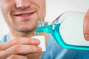 mouthwash-pour-man