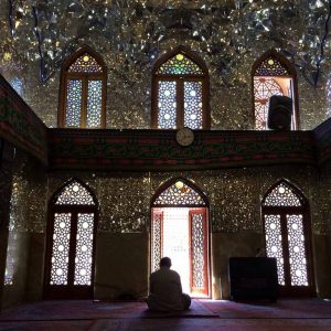 rear-view-of-man-praying-in-imamzadeh-ye-ali-ebn-e-hamze-542032757-59276d685f9b58595003d197